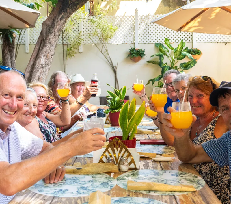 People eating and drinking at Puerto Plata City Tour
